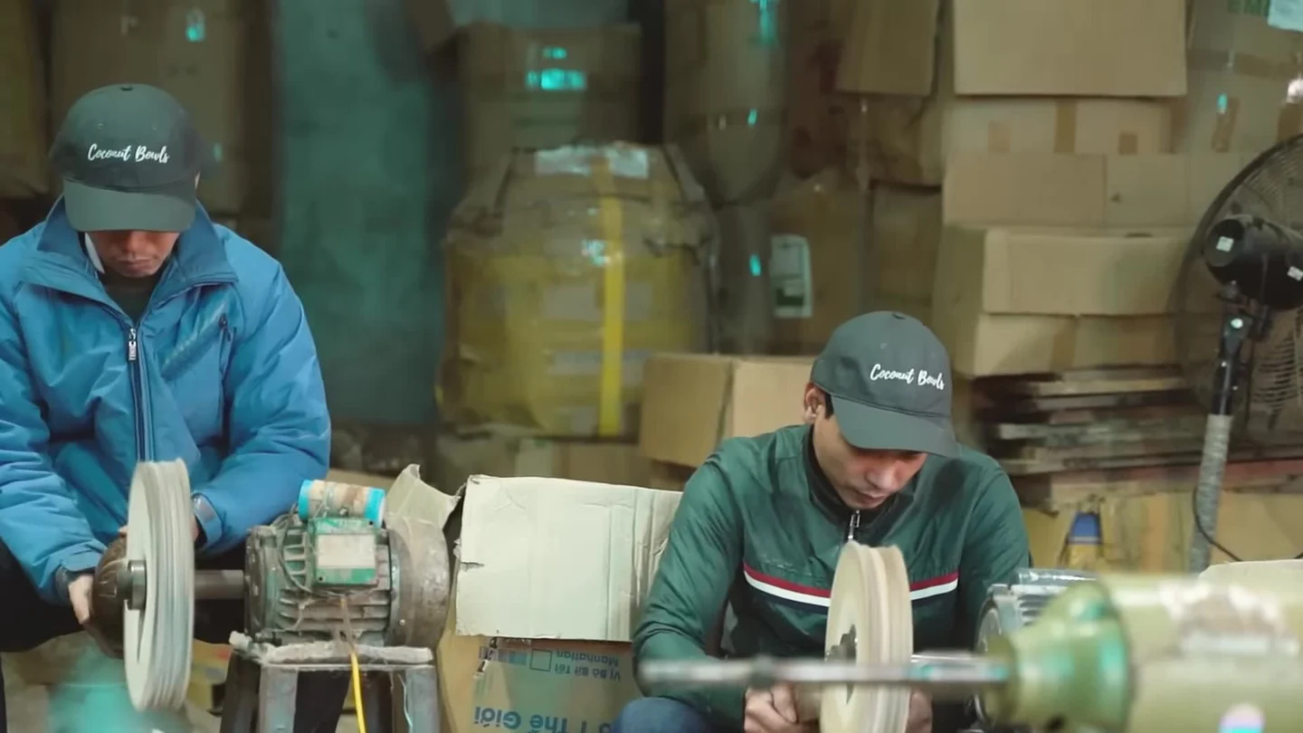 Artisans working with coconut bowls at the workshop